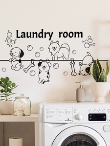 Detail of laundry room wall sticker featuring cartoon dogs and bones on a white wall