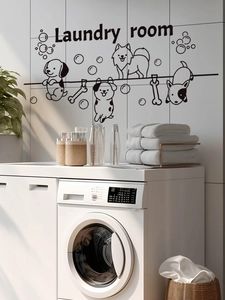 Detail of Laundry Room wall decal with black cartoon dogs and lettering on white tiles
