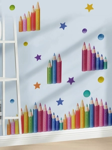 Close-up of colorful cartoon pencil wall stickers with star decals on blue background