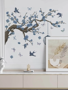 Detail of floral wall stickers with blue flowers and birds in a living room setting