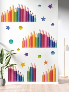 Detailed view of colorful pencil wall stickers with stars on a white living room wall