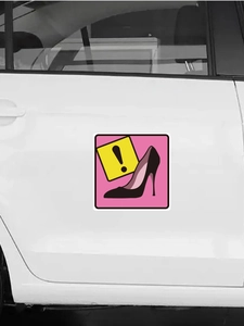 Macro shot of pink high heel warning sticker with exclamation mark on white car door