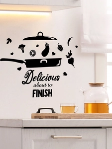 Close-up of black PVC kitchen wall sticker with 'Delicious about to finish' and vegetables