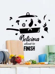 Close-up of black kitchen wall decals with cooking utensils and vegetable silhouettes
