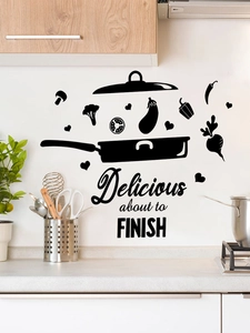 Detail of kitchen wall sticker with flying vegetables and Delicious phrase in black