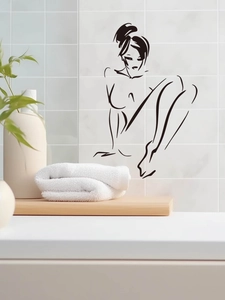 Détail d'un sticker mural design lignes noires femme dans une salle de bain moderne