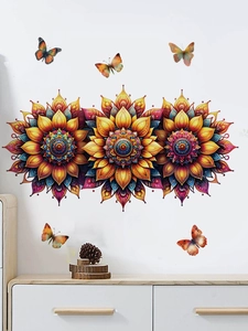 Detail of vibrant mandala flower wall stickers with colorful butterflies on a white wall