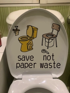 Detail of save paper vinyl decal featuring toilet cartoon on bathroom lid cover