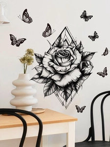 Detail of minimalist black rose wall sticker with geometric frame and butterflies