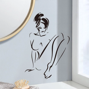 Sticker mural minimaliste aux lignes noires représentant une silhouette féminine
