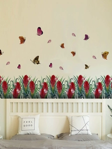 Close-up of vibrant red ginger flower wall stickers with colorful butterflies in bedroom