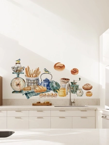 Watercolor kitchen wall decals with coffee grinder, scale and bread on a white wall