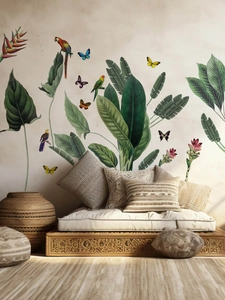 Detail view of tropical plant wall decals featuring parrots and greenery in a modern living room