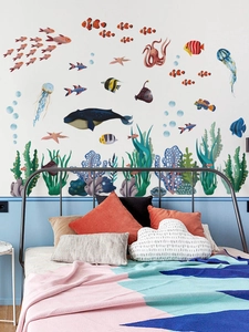 Detail of cartoon ocean wall decals with whale, jellyfish and fish in a kid bedroom