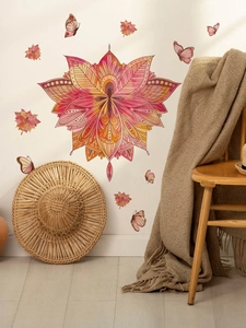 Detail of red mandala flower wall stickers with butterfly accents in boho living room