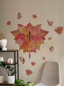 Detail of red mandala flower wall sticker with butterflies in a cozy living room scene