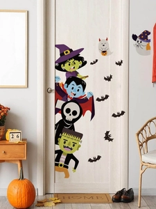 Detailed view of Halloween cartoon door stickers with witch, vampire and ghosts on white door