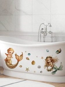 Detail of blonde mermaid wall stickers applied on a bathtub in a modern bathroom