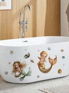 Detailed view of waterproof cartoon mermaid stickers applied on a white bathtub surface