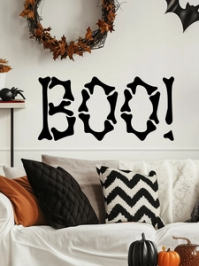 Close-up of Halloween BOO wall decal with bone-shaped letters on a cozy interior wall