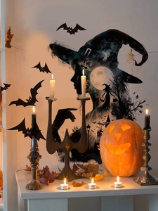 Detailed view of Halloween witch and bats wall decals with candle and pumpkin decor