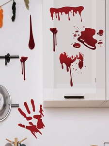 Detail of bloody handprints and dripping blood stickers on kitchen tiles for Halloween
