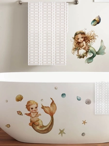 Detail of vintage hand-drawn mermaid wall stickers applied to a white bathtub and wall