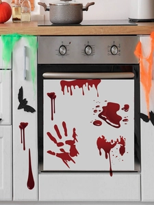 Detail of bloody handprint and blood drip stickers on kitchen cabinets for Halloween