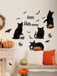 Close-up of Halloween wall stickers with black cats, bats, and Happy Halloween art text