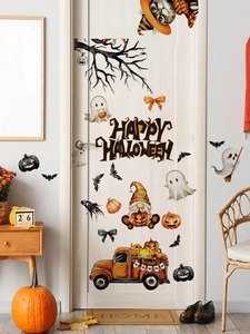 Detail view of Happy Halloween wall stickers featuring ghosts and pumpkins on a white door