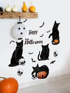 Detail of Halloween wall decals featuring black cats, bats and skulls on a white wall