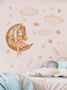 Détail de stickers muraux lune et fille dans une chambre d'enfant aux tons rose doux