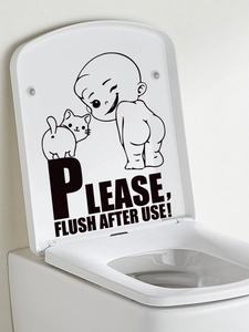 Detail of funny cartoon boy and cat PVC wall sticker on white toilet lid with flush reminder