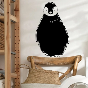 Minimalist black and white penguin wall sticker for home decor in a cozy living room