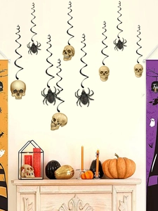 Detail of hanging Halloween spiral decorations with golden skulls and black spiders