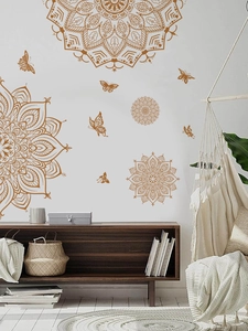 Detail of golden mandala wall stickers with butterflies in a boho style living room