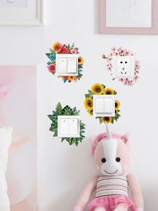 Detail showing four floral and leaf PVC stickers for bedroom wall socket decoration