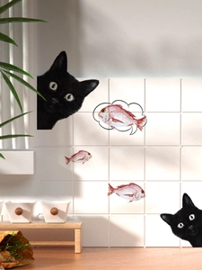 Detail of funny black cat peeking wall stickers on white tiles with pink fish elements