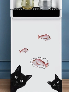 Detail of creative peeping black cat wall decals and fish stickers on white fridge