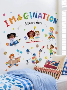 Detailed view of colorful astronaut wall stickers with Imagination text on a white wall