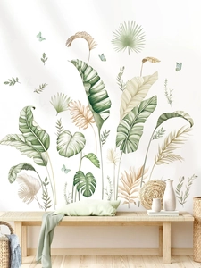 Detailed view of tropical banana leaf wall stickers with monstera leaves in Nordic interior