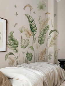 Close-up of tropical banana leaf wall stickers in a cozy bedroom corner setting
