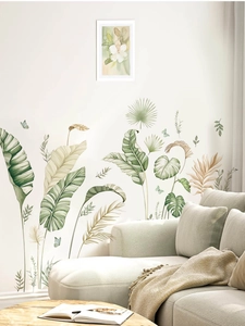 Detail view of tropical banana leaf wall stickers with monstera and butterfly in living room