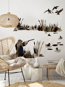 Hunting theme wall stickers with hunter silhouette and wild ducks in a living room