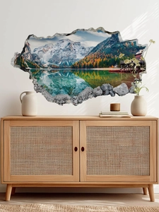 Macro detail of a 3D wall sticker featuring snow mountains and a forest lake landscape