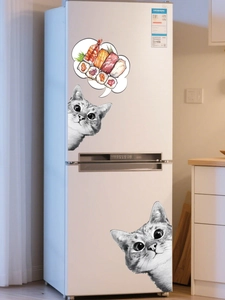 Detail of realistic cat and sushi wall stickers on a white refrigerator surface
