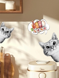 Detail of cat wall stickers with sushi dialogue bubble above a kitchen rice cooker