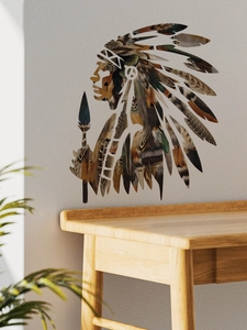Detail of ethnic Indian wall decal silhouette with intricate feather textures on grey wall