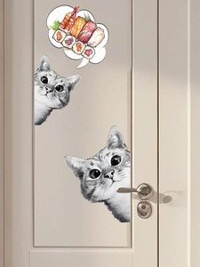 Detail showing creative hand-drawn cat and sushi wall stickers on a wooden door surface
