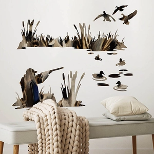 Hunting wall decals set with hunters and wild ducks on a minimalist living room wall